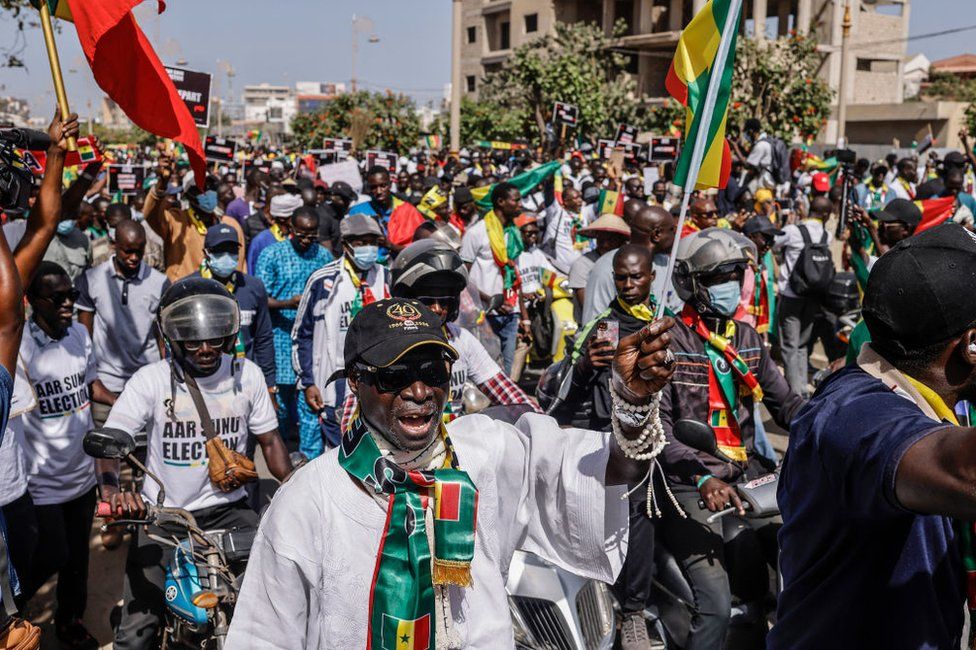 Civil society groups and political groups march calling on authorities respect the election date, in Dakar, on 17 February.