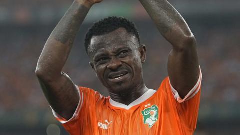 Jean Michael Seri applauds the Ivory Coast fans after the final