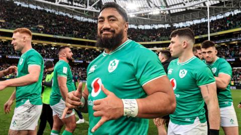 Bundee Aki poses after Ireland's win over Wales