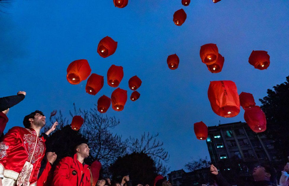 People release Kongmin lanterns to celebrate the Lantern Festival in Chongqing, China