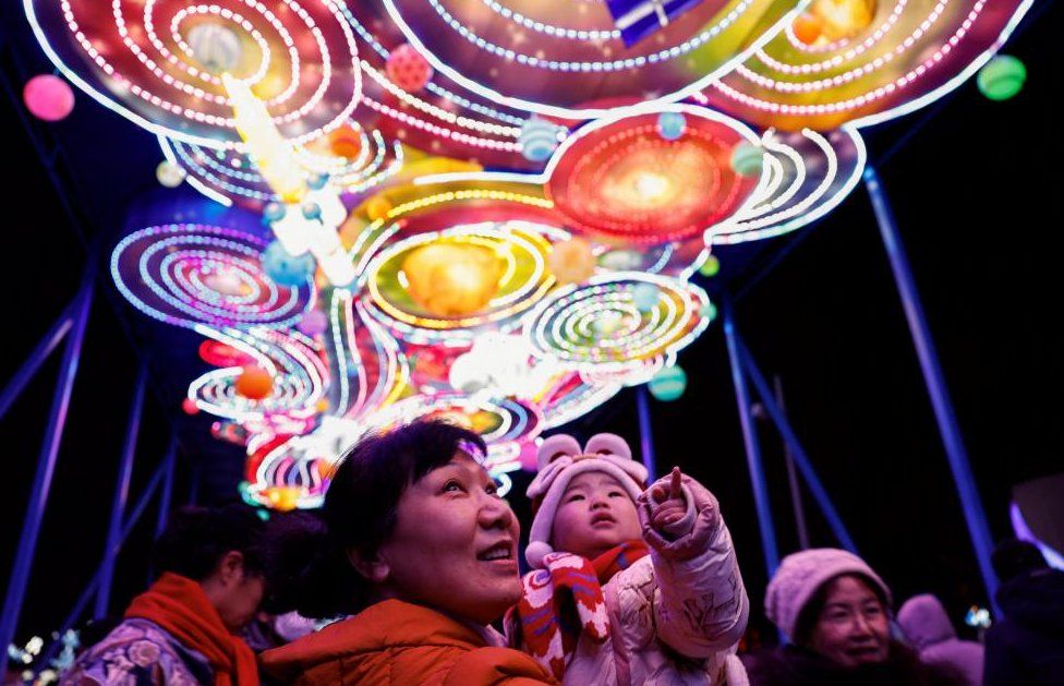 People enjoy light installations at a park on Lantern Festival in Beijing, China