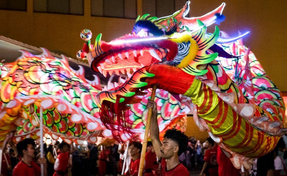People perform a dragon dance during Cap Go Meh festival on the occasion of the last day for Lunar New Year of the Dragon celebrations, at a shopping mall in Bogor, West Java, on February 24, 2024