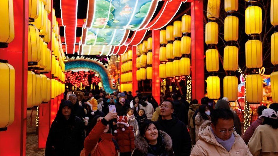 People look at light installations as part of Lantern Festival in Beijing, China