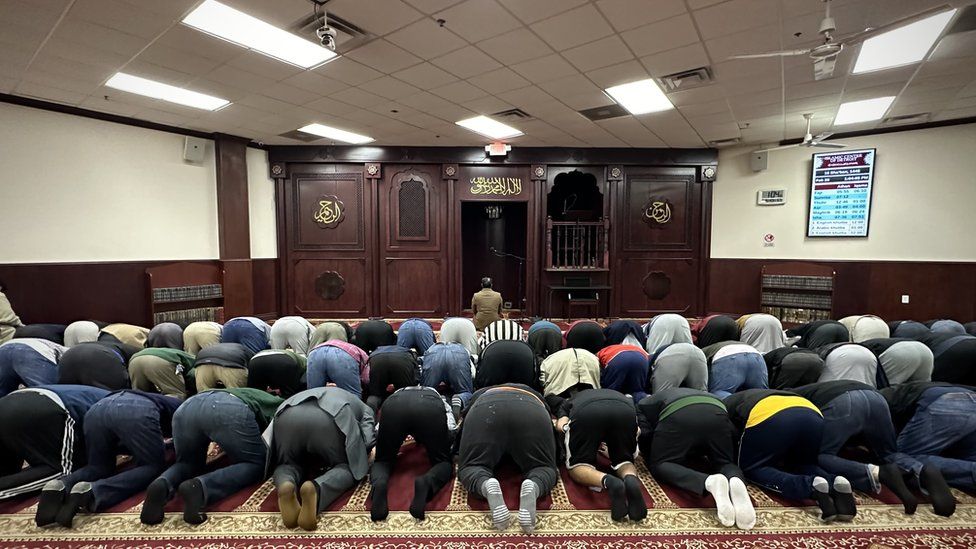 Dozens of Muslims pray at a Detroit mosque